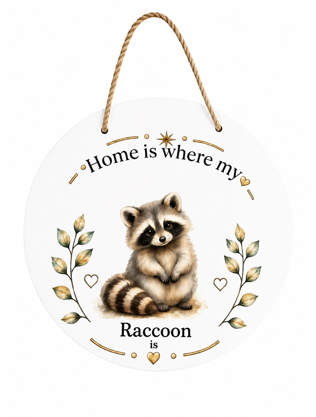 A round white hanging wall sign with a rope hanger, featuring an illustration of a raccoon in the center and the text 'Home is where my Raccoon is' with decorative gold and green leaf accents, shown on a plain white background.
