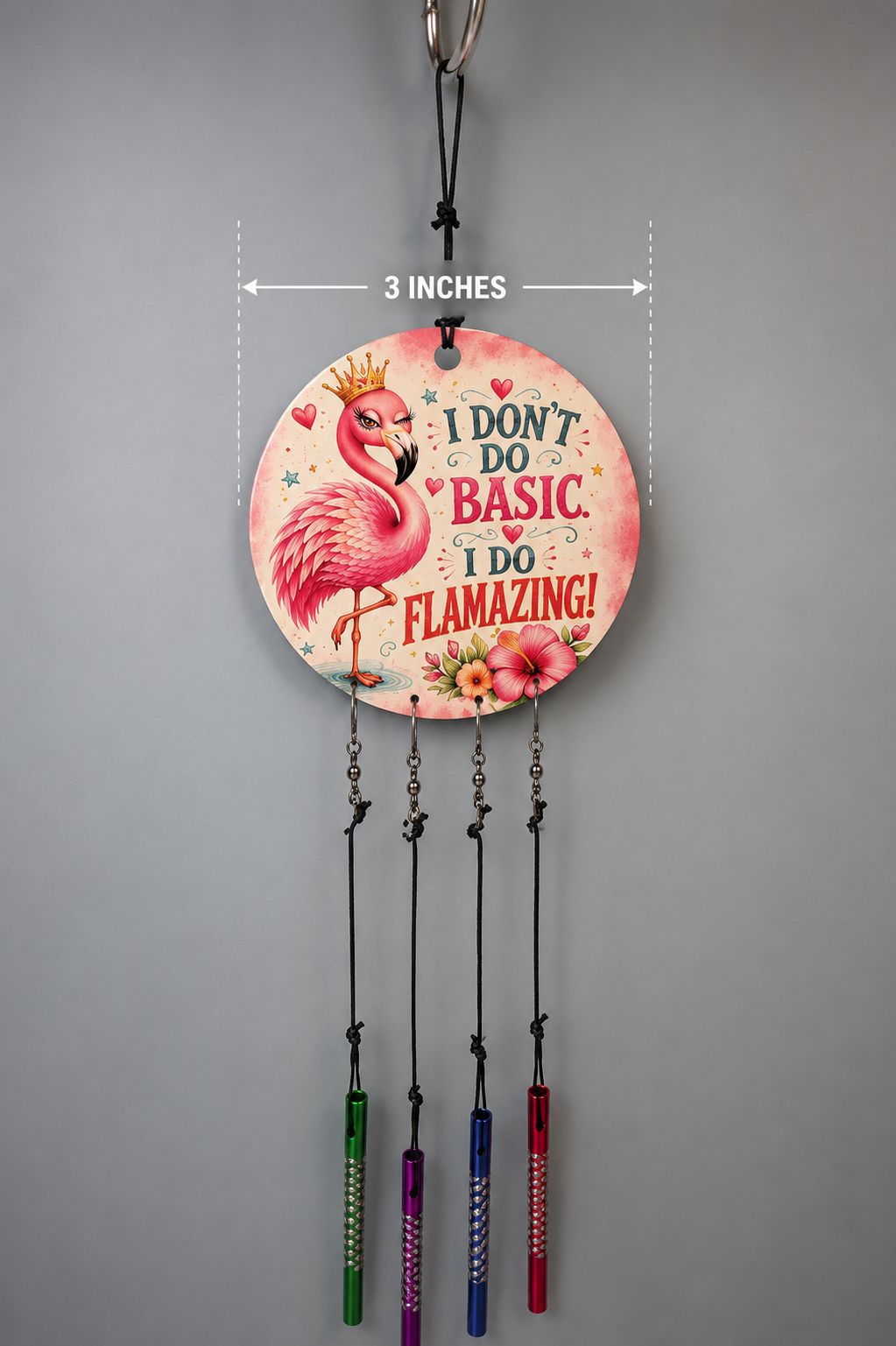 Decorative wall hanging with flamingo design and text on a gray background