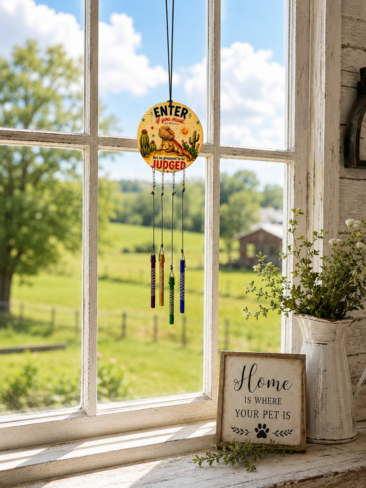 Decorative hanging sign with a scenic view outside a window