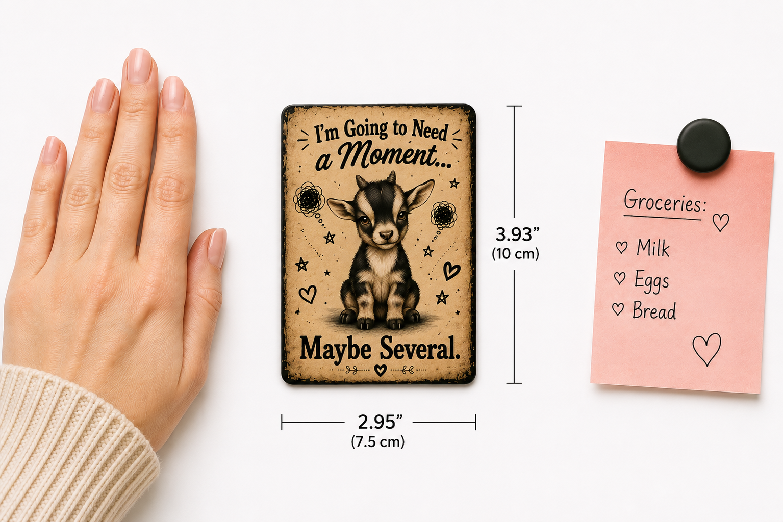 A rectangular printed card or magnet with a goat illustration and the text 'I'm Going to Need a Moment.
