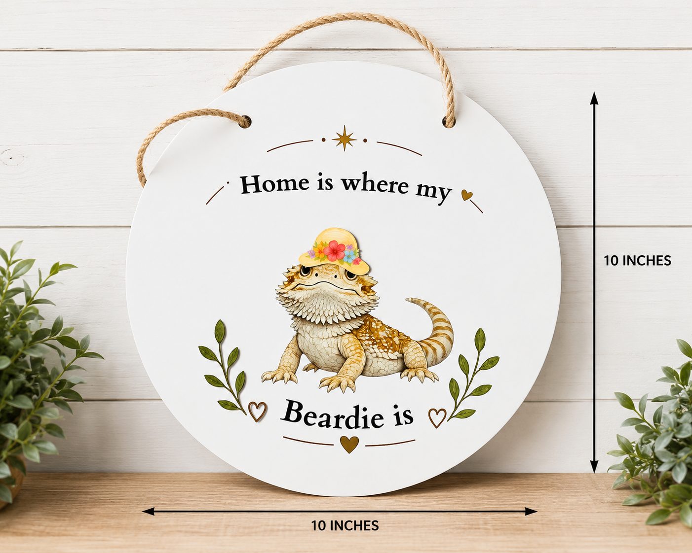 Round metal sign with a bearded dragon illustration and text 'Home is where my Beardie is' on a white background.