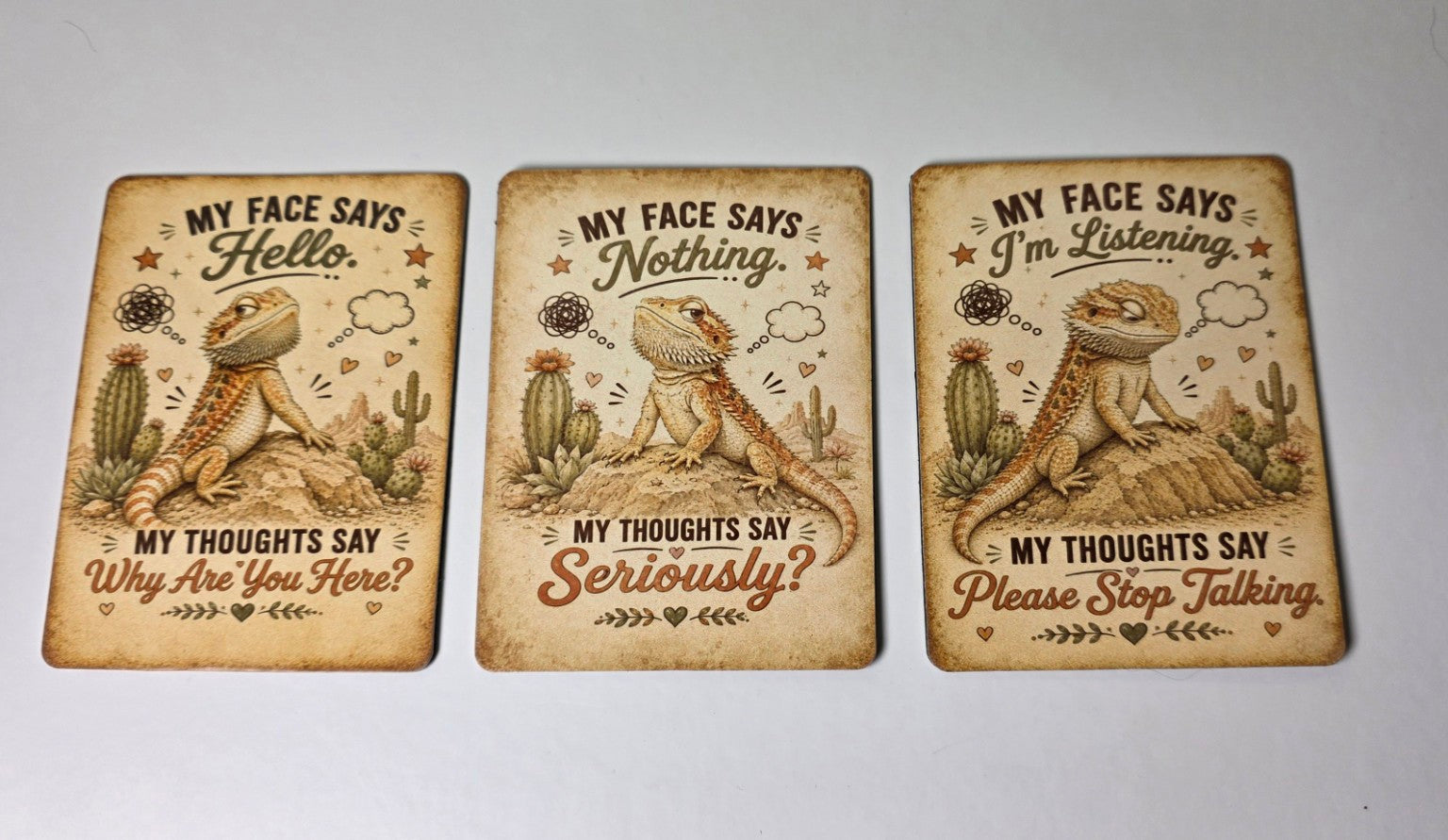 Three decorative magnet with lizard illustrations and humorous text on a white background