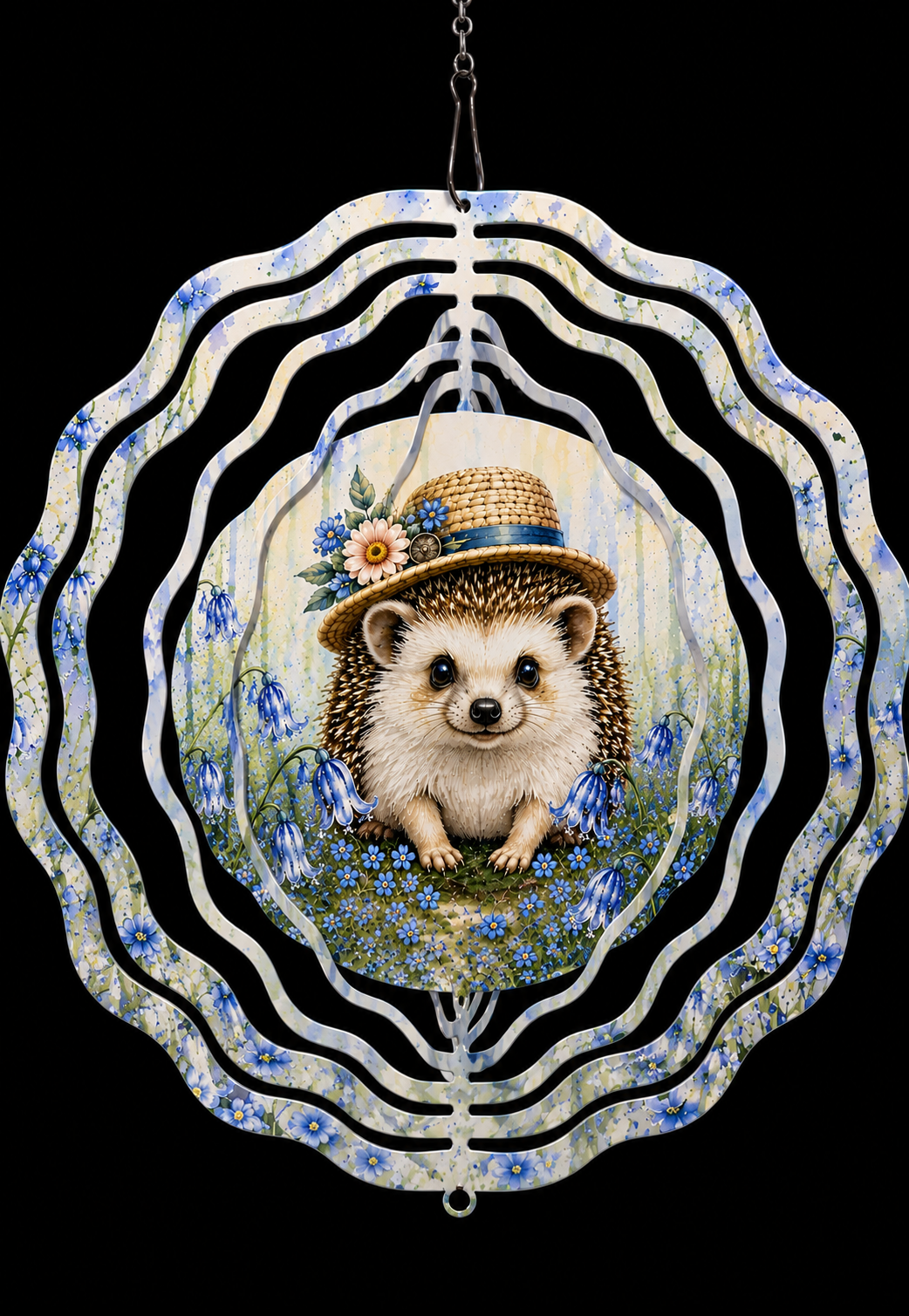 A decorative hanging metal wind spinner with a central illustration of a hedgehog wearing a straw hat and surrounded by blue flowers, set against a solid black background.