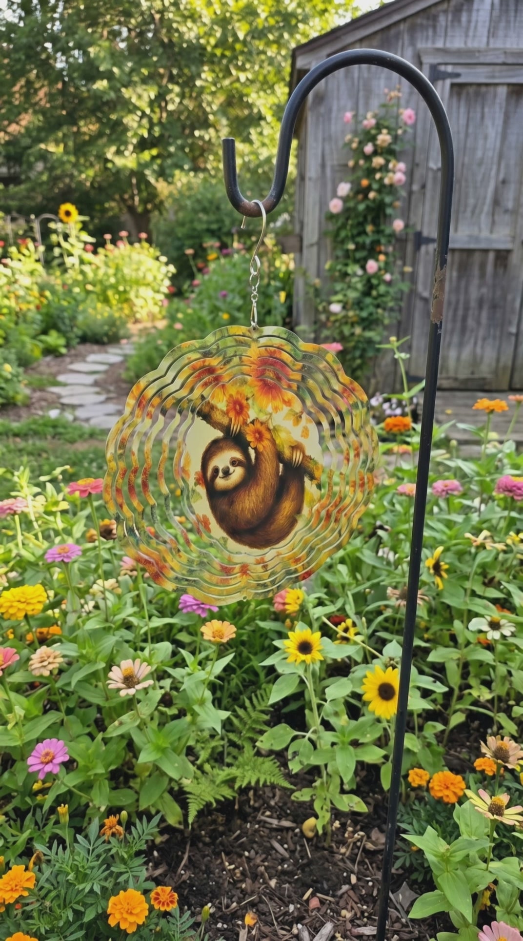 metal garden wind spinner featuring a sloth illustration  spinning video