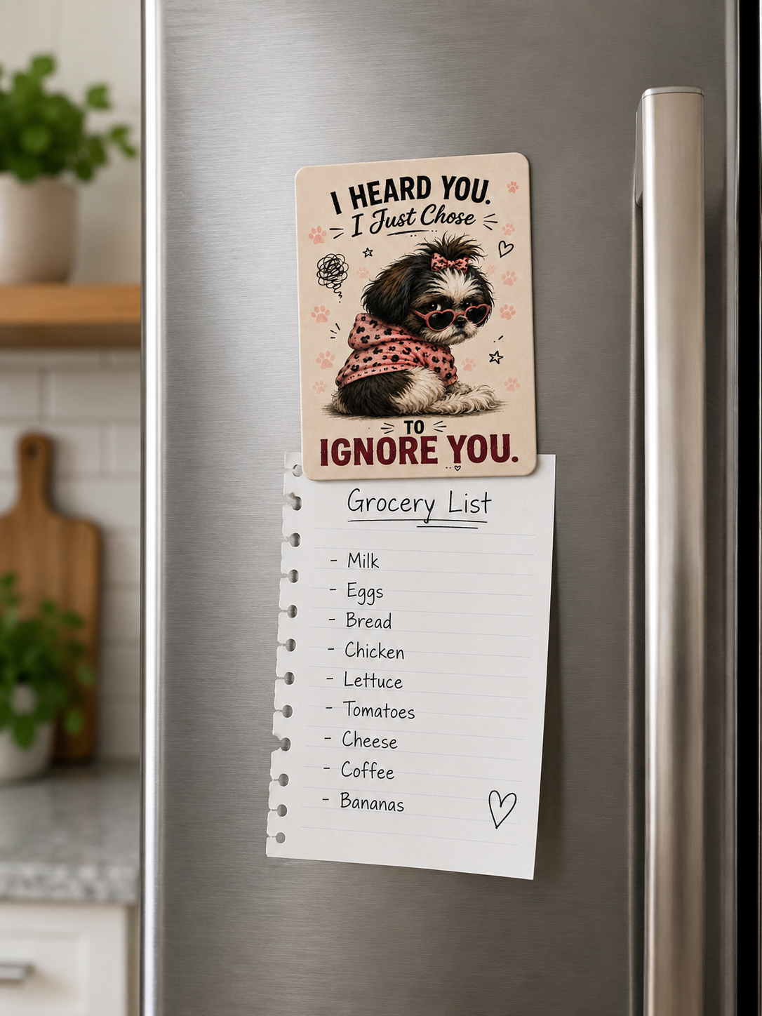 Fridge magnet with a dog illustration and grocery list on a metallic refrigerator.