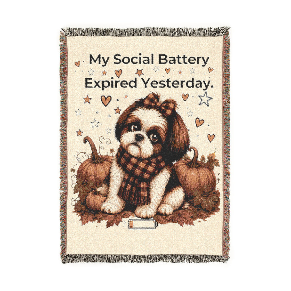 A woven throw blanket with fringe edges featuring a cute Shih Tzu dog sitting between pumpkins, wearing a plaid scarf, with the text 'My Social Battery Expired Yesterday.' on a cream background.